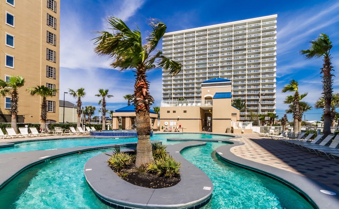 View of Crystal Tower Condominium from the lazy river and beach pool.