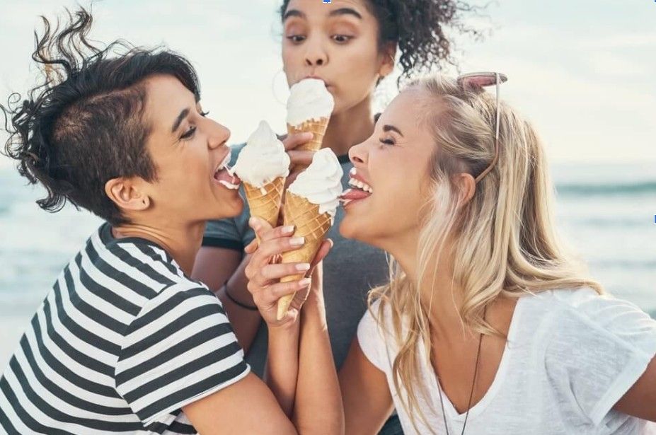 3 girls licking an ice cream cone