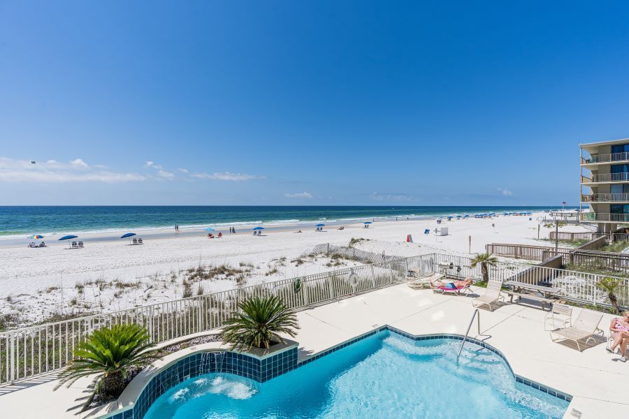 view of pool and beach front rental