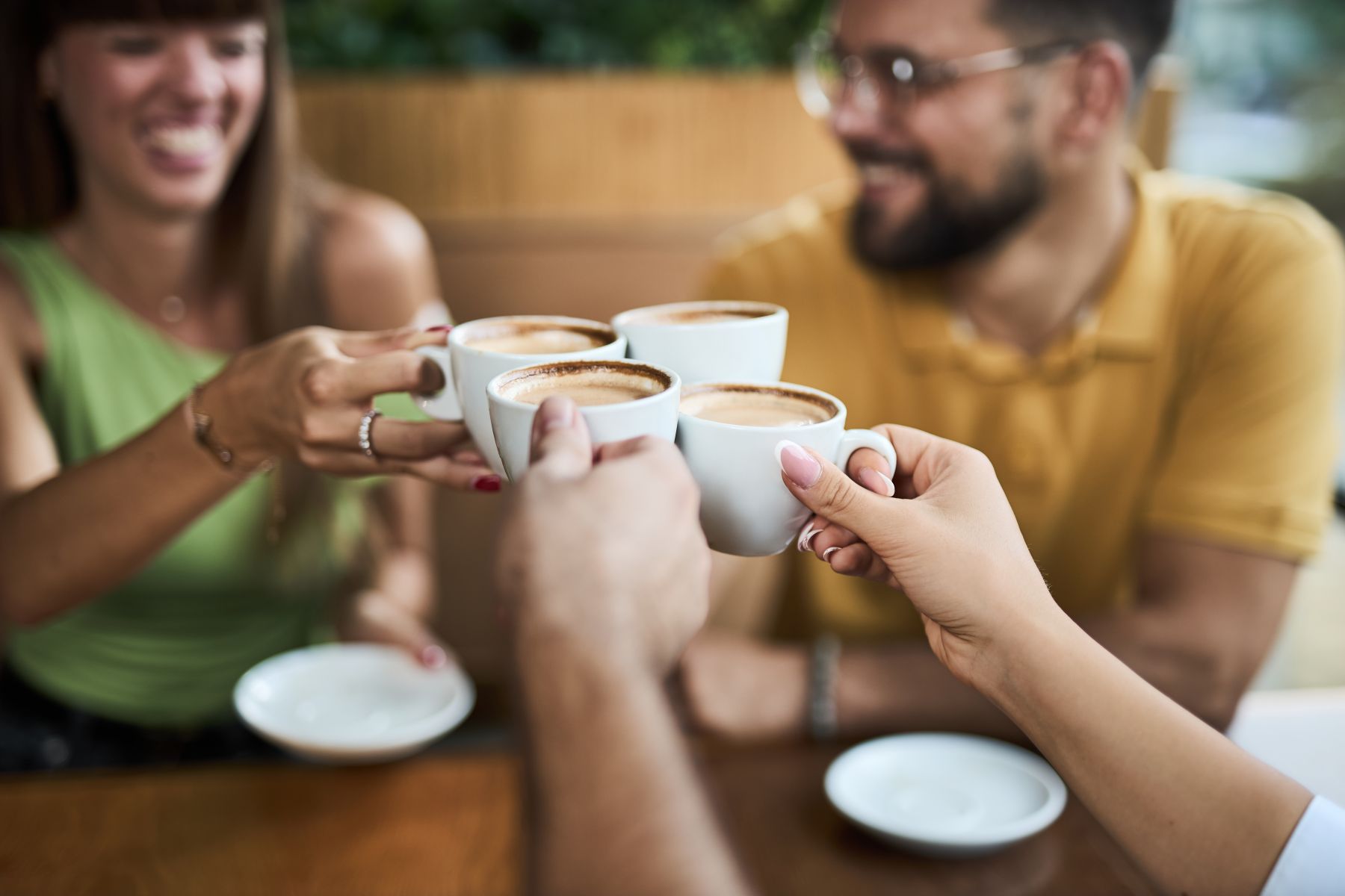 A group of friends with coffee at a cafe